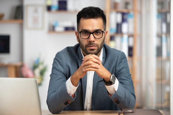 Man looking at camera with serious look on face